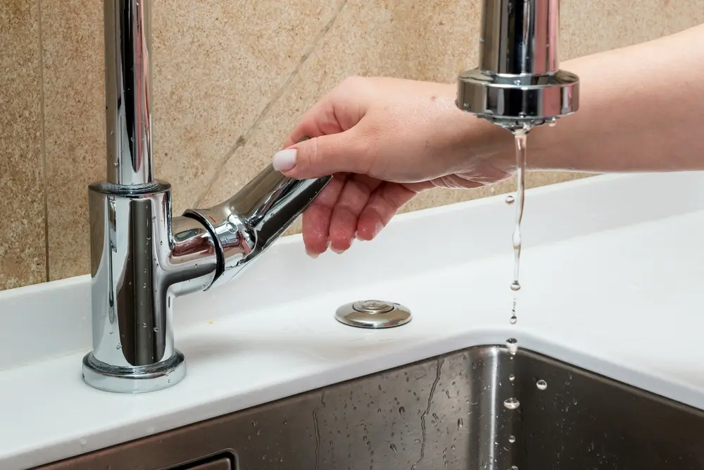 The concept of lack of tap water. The faucet has no running water